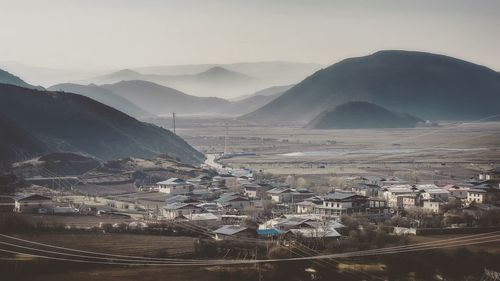 High angle view of agricultural landscape against sky