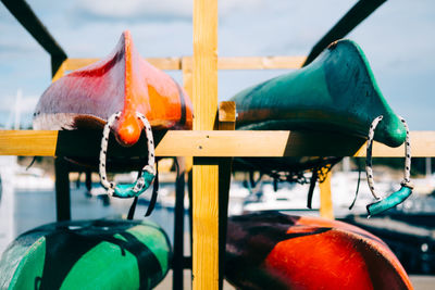 Close-up of kayaks moored on beach