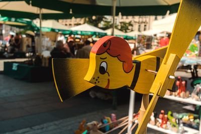 Wooden bee shaped play equipment at traveling carnival