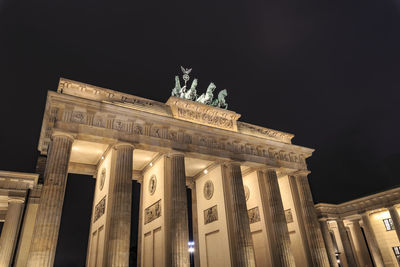 Low angle view of statue at night