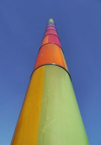 Low angle view of yellow structure against sky