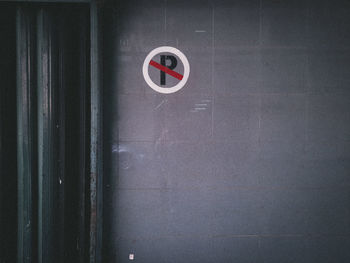 Close-up of red sign on wall