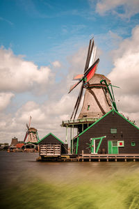 Traditional dutch windmill at the river zaan