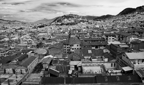 Cityscape with mountain range in background