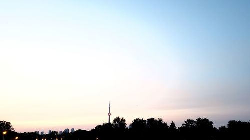 Low angle view of silhouette trees against sky during sunset