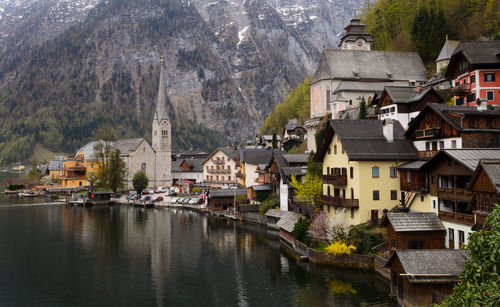 Buildings by lake in town