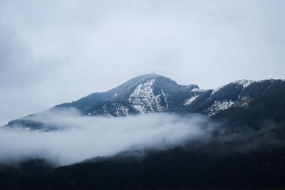 Scenic view of mountains against sky during winter