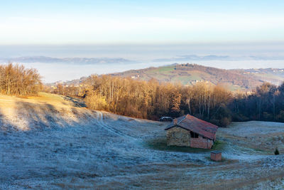 Landscape of mountains and plains covered by the fog