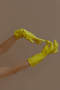 Close-up of hand holding yellow leaf