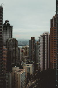 High angle view of buildings in city against sky in hong kong