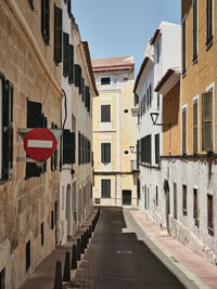 One-way narrow street in mahon, menorca, spain