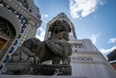 Low angle view of statue against sky