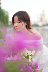 Portrait of young woman with roses