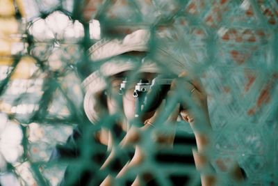 Close-up of person photographing through camera