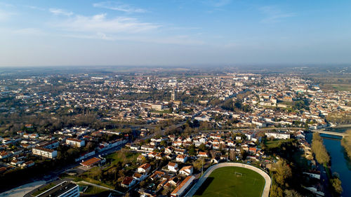 High angle view of buildings in city against sky