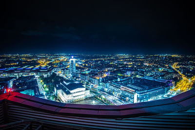 High angle view of illuminated buildings in city at night