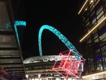 Low angle view of illuminated building at night