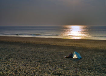 Scenic view of sea against sky during sunset