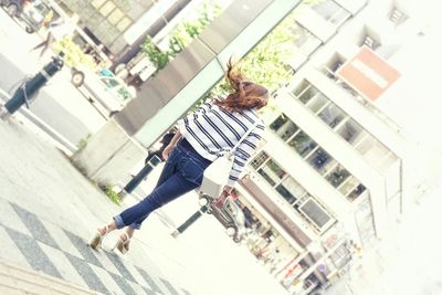 Woman standing in front of building