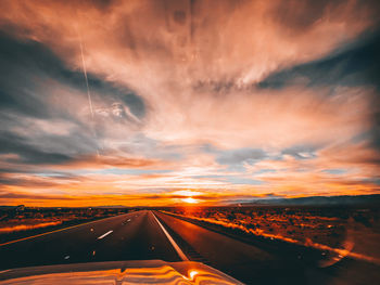 Road against sky during sunset