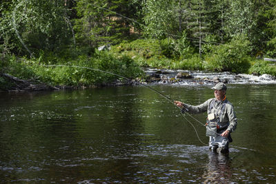 Man fishing in river