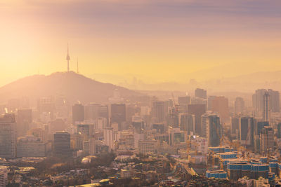 Cityscape against sky during sunset