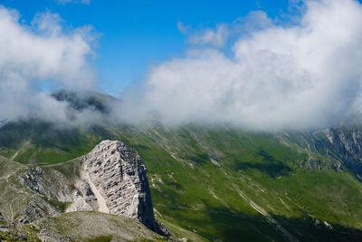 Scenic view of mountains against cloudy sky in montemonaco, marche italy 