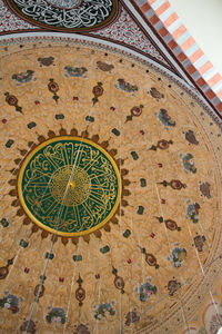 Low angle view of clock on wall