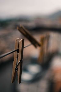 Close-up of clothespins on clothesline