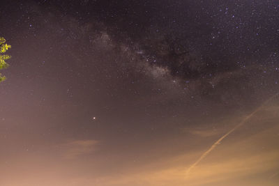 Low angle view of star field against sky