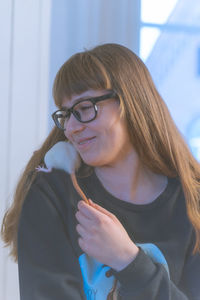 Close-up of smiling girl with rat