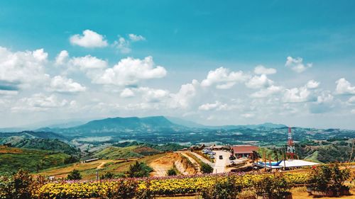 Panoramic view of houses and buildings against sky