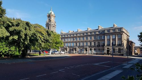 Buildings in city against sky