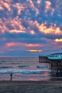 Scenic view of beach against sky during sunset