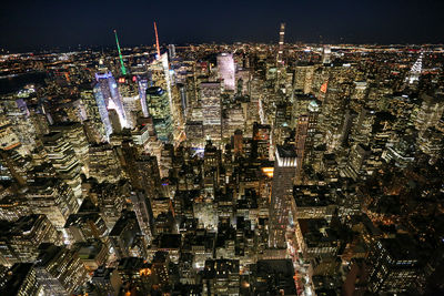 Aerial view of illuminated cityscape at night