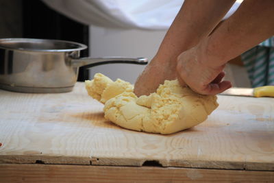 Close-up of person preparing food on table