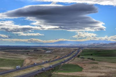 Scenic view of landscape against cloudy sky