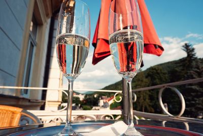 Close-up of wine glass against the sky