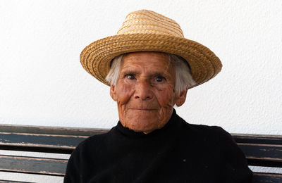 Close-up portrait of senior woman wearing hat