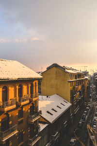 High angle view of buildings in town against sky