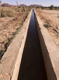 Surface level of dirt road along countryside landscape