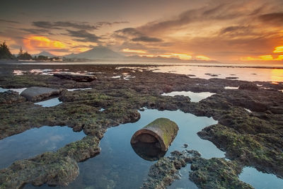 Scenic view of sea against sky during sunset