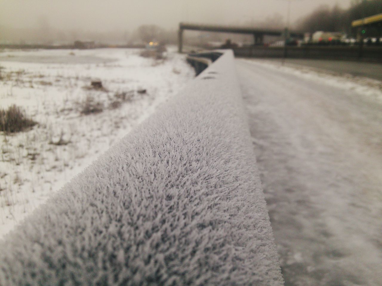 CLOSE-UP OF SNOW COVERED LAND