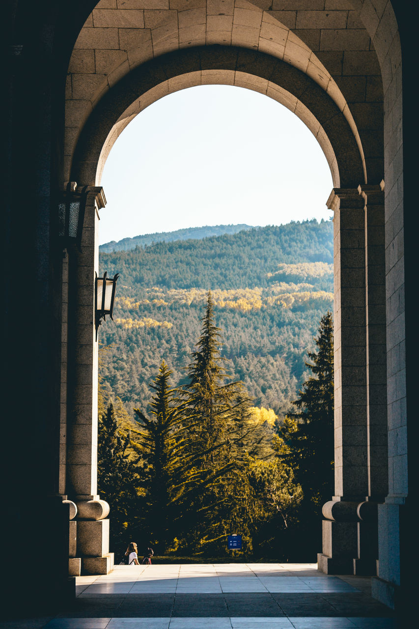 SCENIC VIEW OF MOUNTAINS SEEN FROM WINDOW