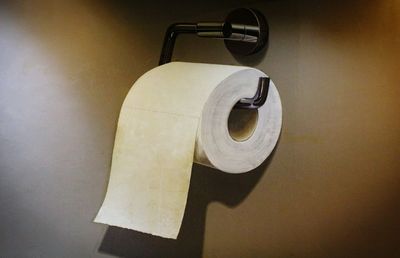 Close-up of paper hanging on wall