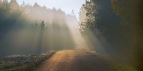 Scenic view of landscape against sky during foggy weather