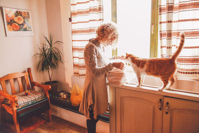 Woman with dog at home