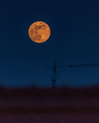 Scenic view of moon against clear sky at night