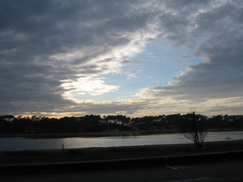 Scenic view of lake against sky during sunset