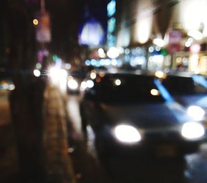 Defocused image of illuminated city at night